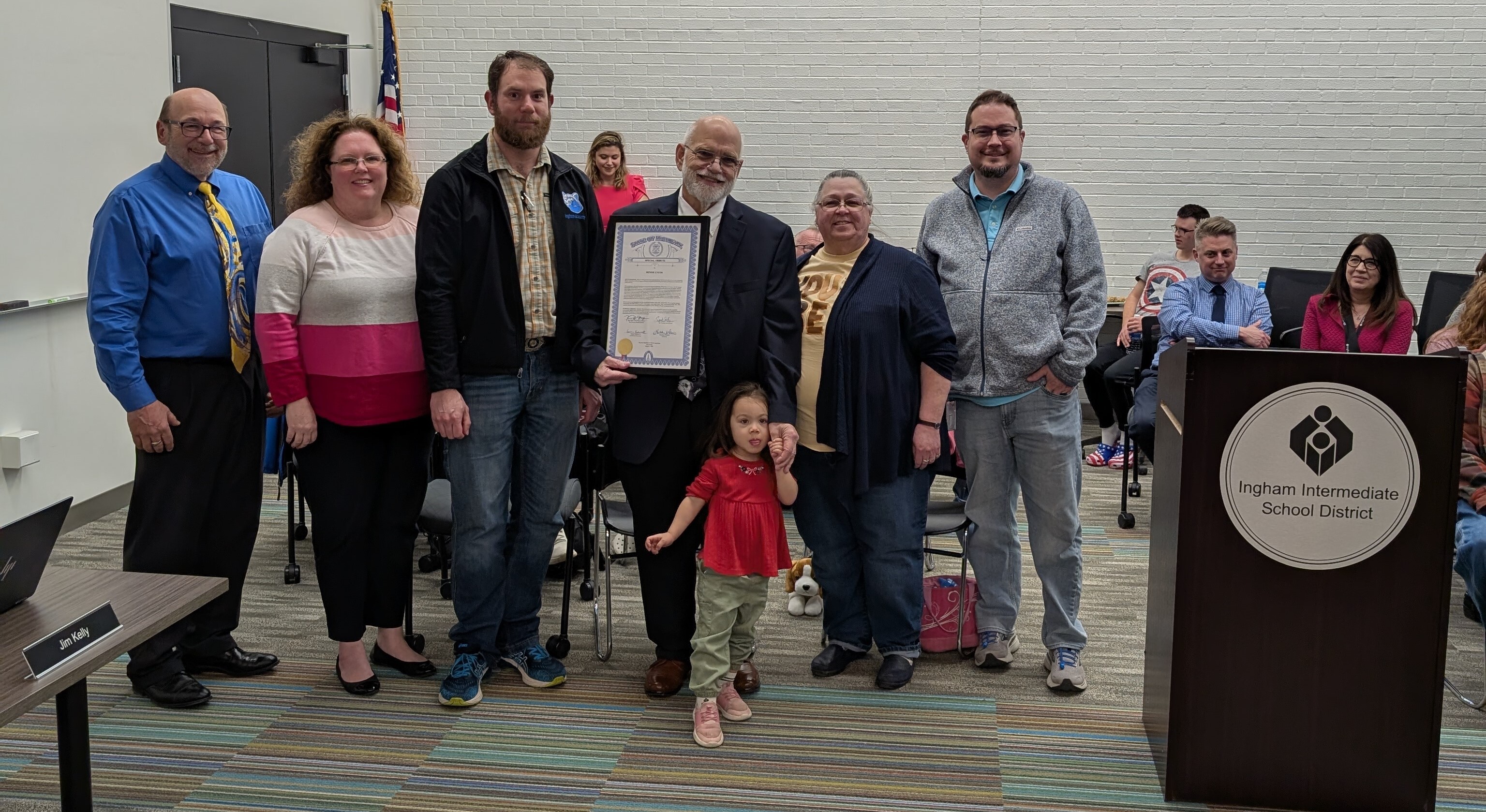 Family of Denise Lycos accepting an award on her behalf