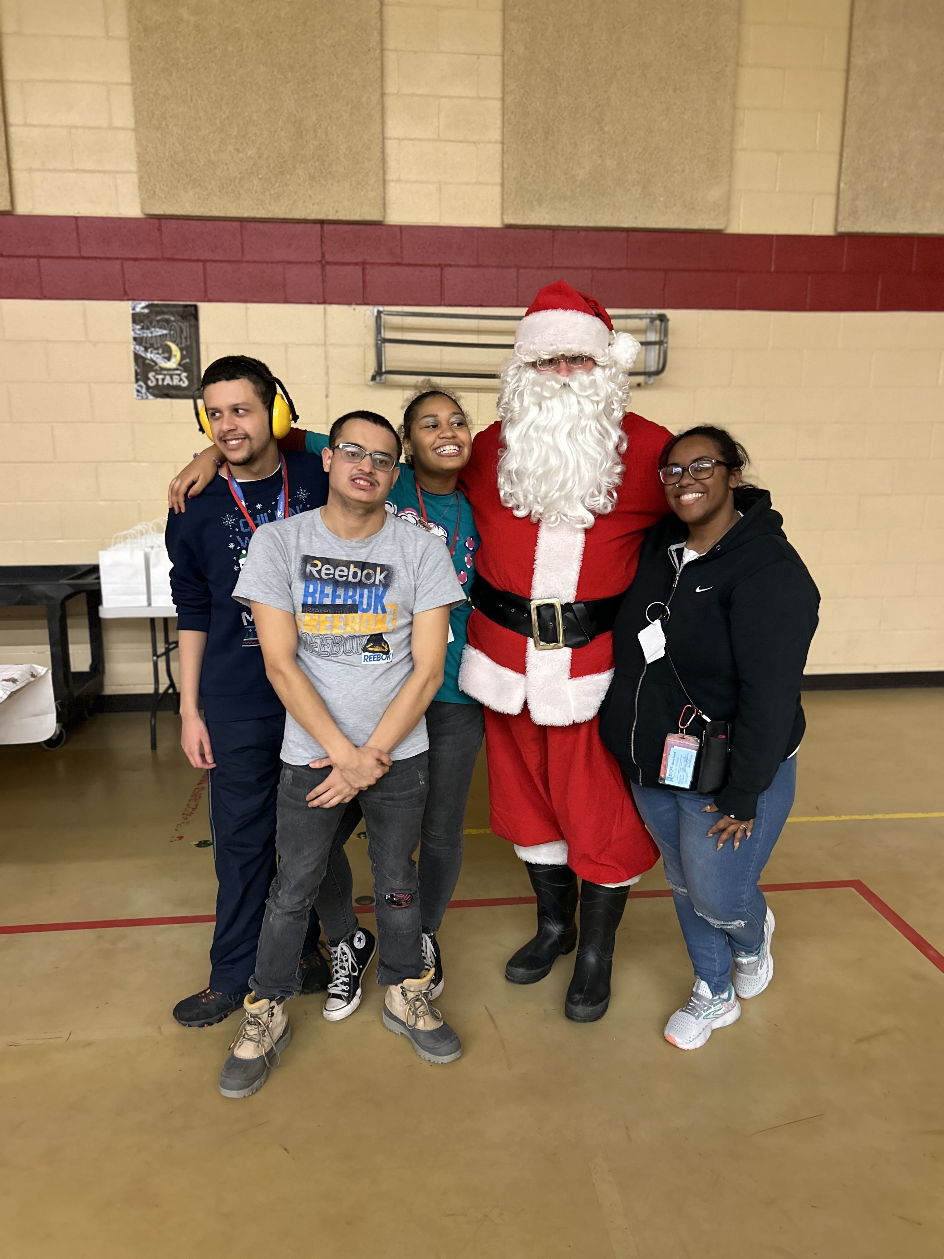 students standing with Santa